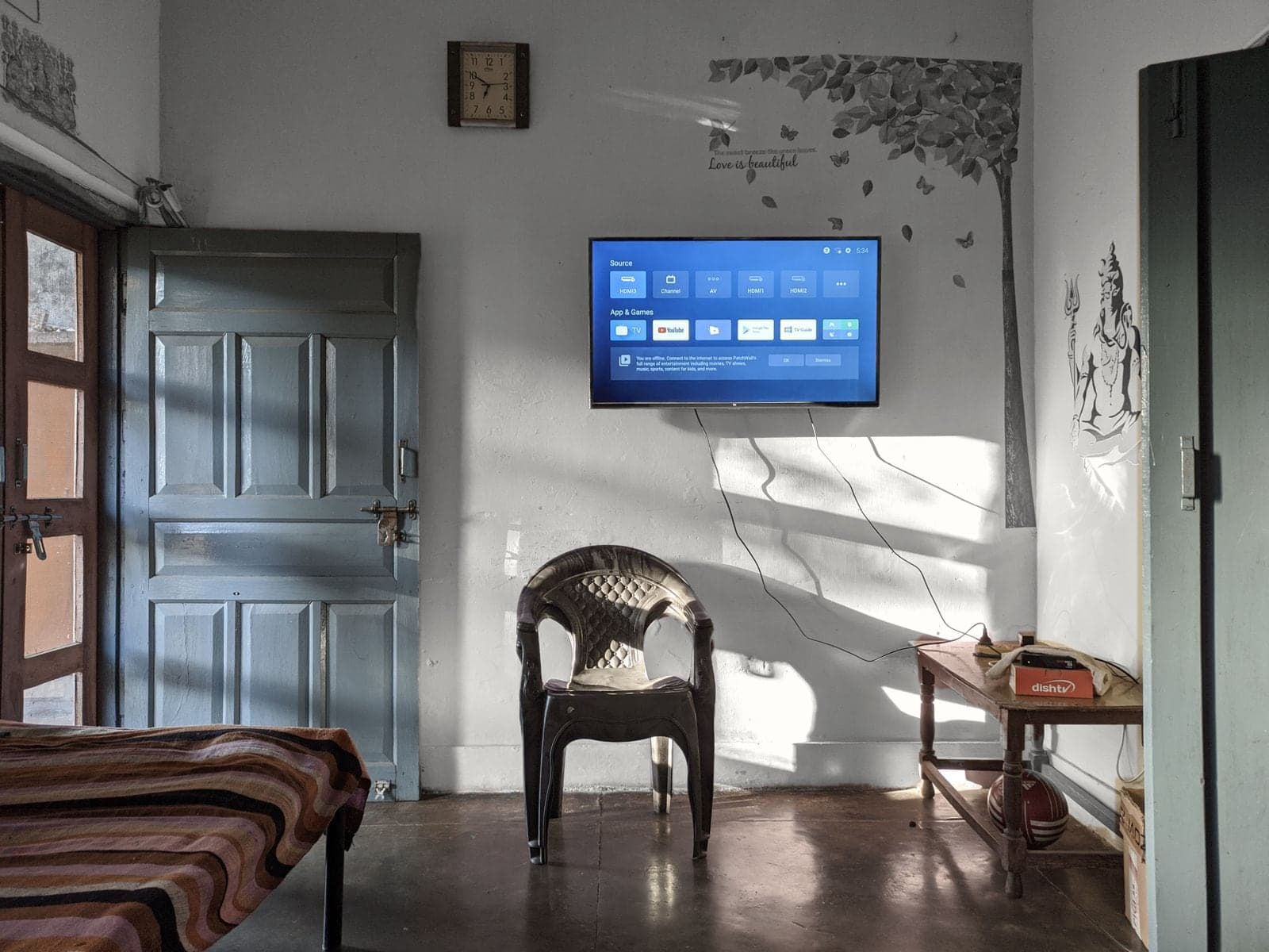 Living room with the walls being painted Pepper Leaf